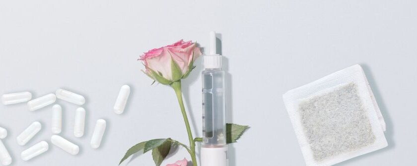 Injection pen and capsules representing GLP-1 medications Mounjaro and Ozempic, alongside a rose — illustrating life after stopping weight loss injections