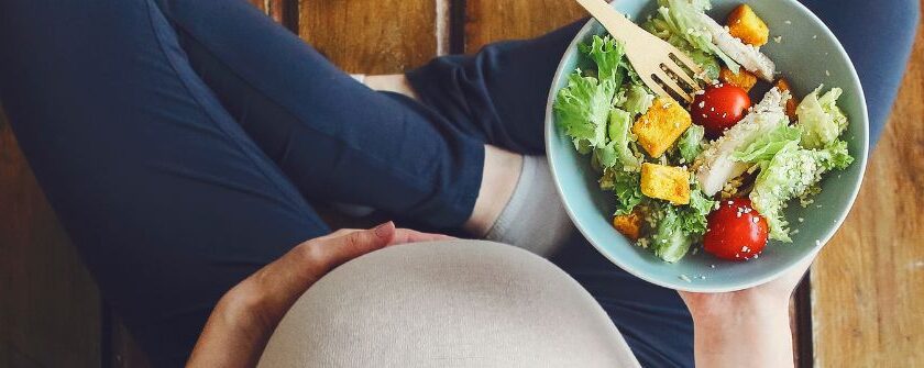 pregnancy nutrition - pregnant woman with healthy salad